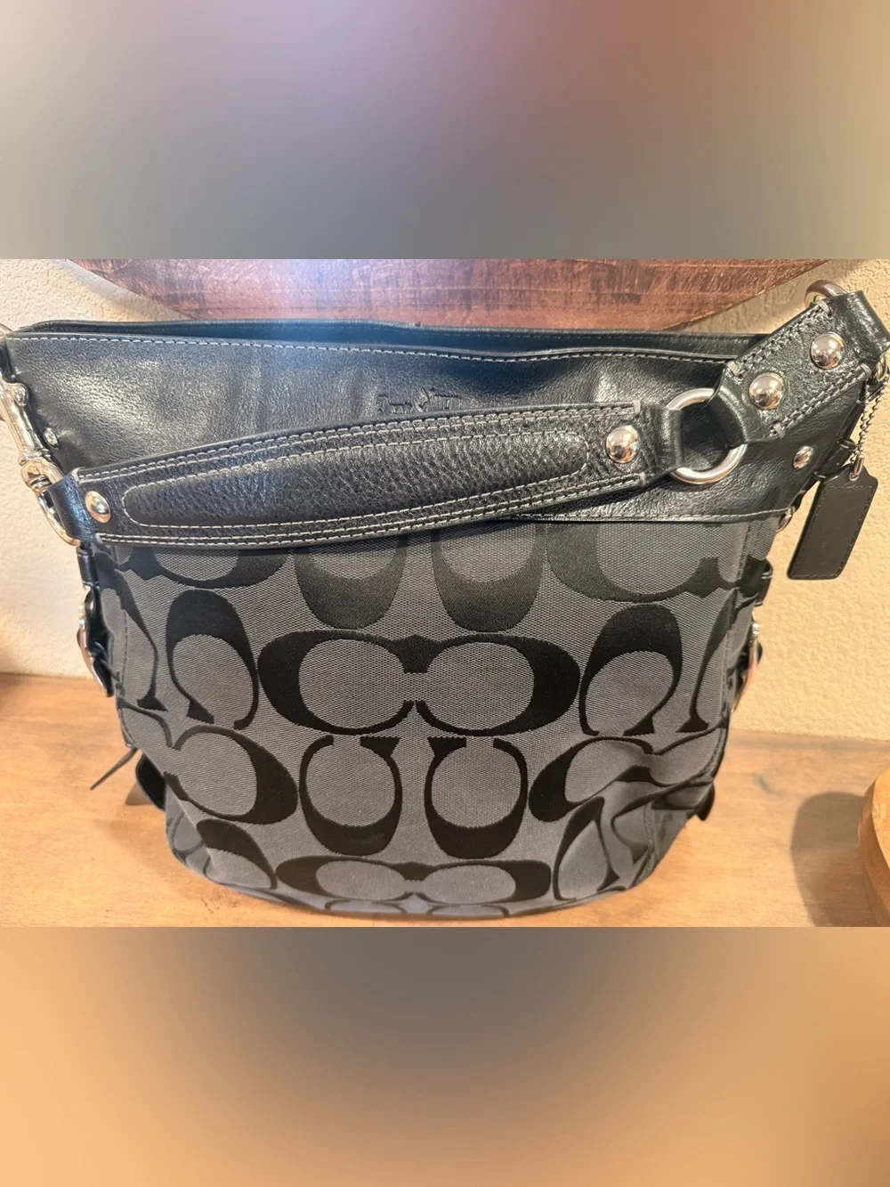 Coach Signature Logo Large Shoulder Bag in Black with large silver buckle detai